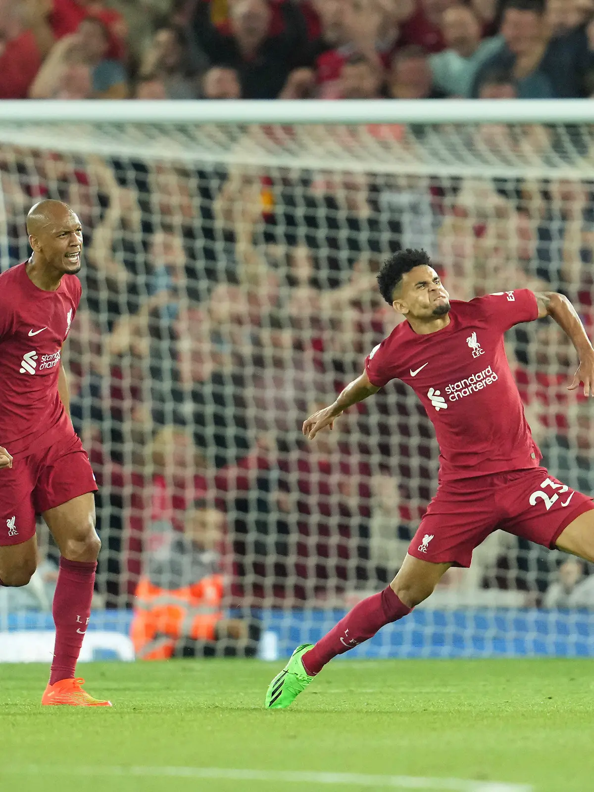 Liverpool's Luis Diaz, right, celebrates after scoring his side's opening goal during the English Premier League soccer match between Liverpool and Crystal Palace at Anfield stadium in Liverpool, England, Monday, Aug. 15, 2022. (AP Photo/Jon Super)