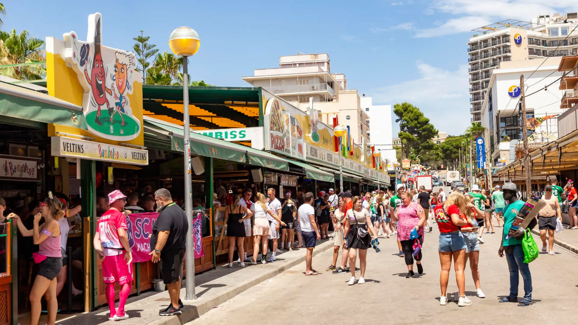 Palma de Mallorca, Spain - June 22, 2022: people have party at the Schinkenstrasse, engl: Ham Street at Ballermann - engl: fun man in Palma.