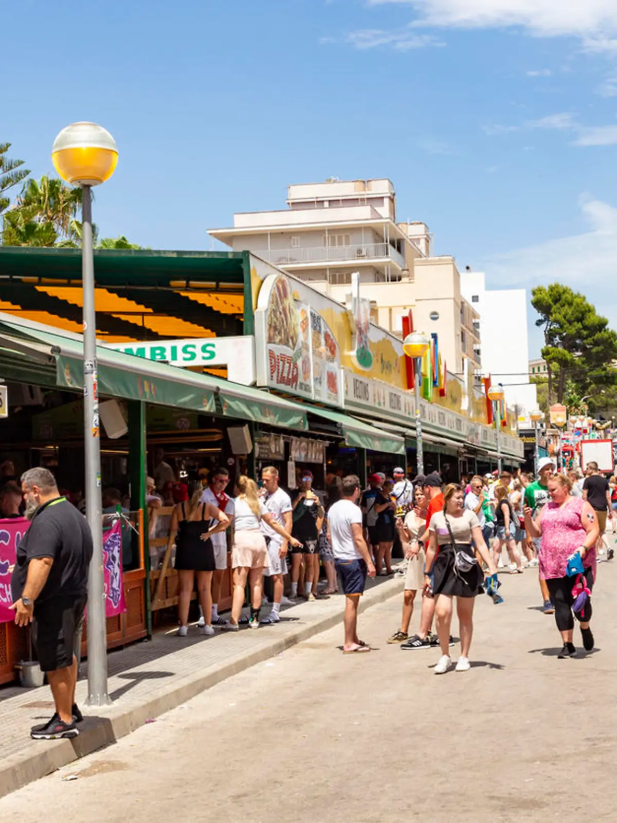 Palma de Mallorca, Spain - June 22, 2022: people have party at the Schinkenstrasse, engl: Ham Street at Ballermann - engl: fun man in Palma.