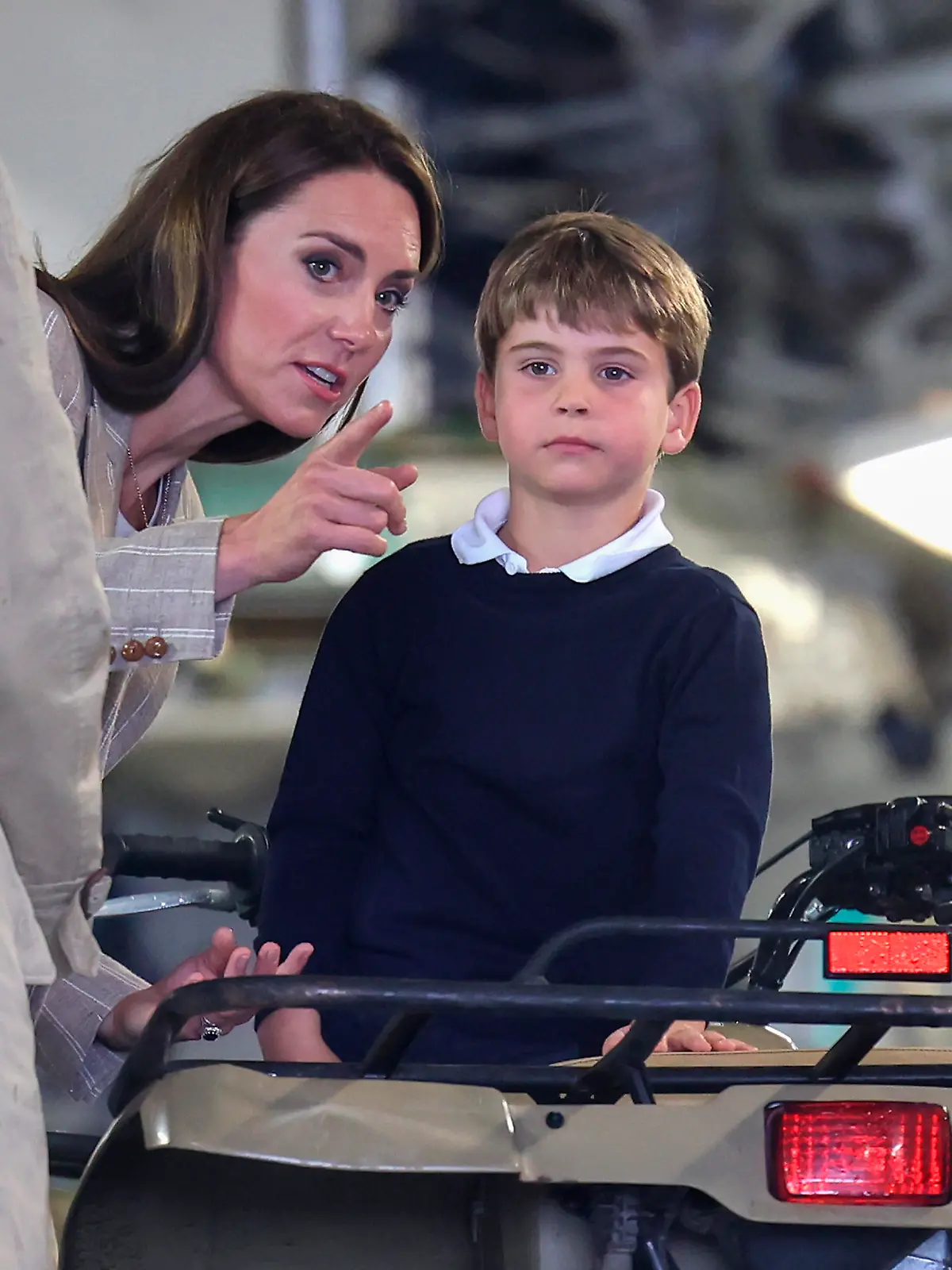 Royal visit to Royal International Air Tattoo. The Princess of Wales with Prince Louis sitting on a quad bike inside a C-17 aircraft during a visit to the Royal International Air Tattoo (RIAT) at RAF Fairford, Gloucestershire. Picture date: Friday July 14, 2023. See PA story ROYAL Wales. Photo credit should read: Chris Jackson/PA Wire URN:72999095