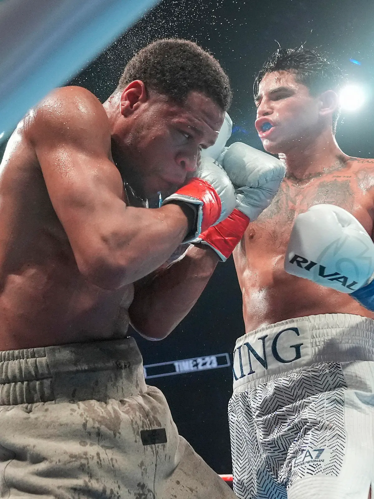 Ryan Garcia, right, punches Devin Haney during the eighth round of a super lightweight boxing match early Sunday, April 21, 2024, in New York. Garcia won the fight. (AP Photo/Frank Franklin II)