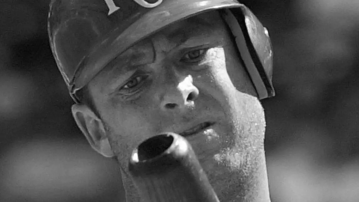 FILE - Kansas City Royals batter Dave McCarty inspects his bat after hitting a foul ball during the seventh inning against the Texas Rangers in a baseball game in Arlington, Texas, May 31, 2001. McCarty, a member of the Boston Red Sox championship team in 2004 who played with seven MLB teams in an 11-year career, has died. He was 54. The Red Sox announced McCarty's death in a statement, saying the former first baseman and outfielder died Friday, April 19, 2024, after suffering a cardiac event in Oakland, Calif. (AP Photo/Bill Janscha, File)