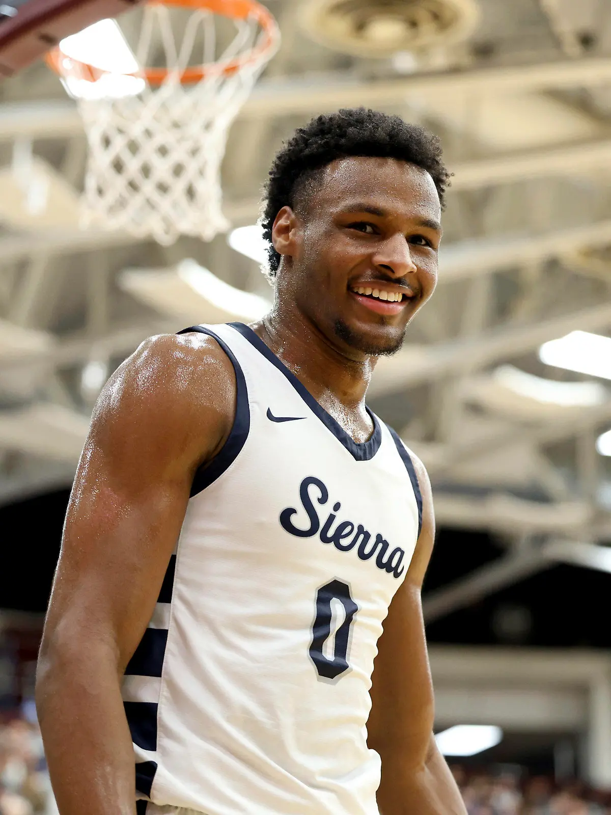 FILE - Sierra Canyon's Bronny James (0) smiles during a high school basketball game against Christopher Columbus at the Hoophall Classic, Monday, Jan. 16, 2023, in Springfield, Mass. Bronny James, son of NBA superstar LeBron James, was hospitalized after going into cardiac arrest while participating in a practice at Southern California on Monday, July 24, 2023. (AP Photo/Gregory Payan, File)