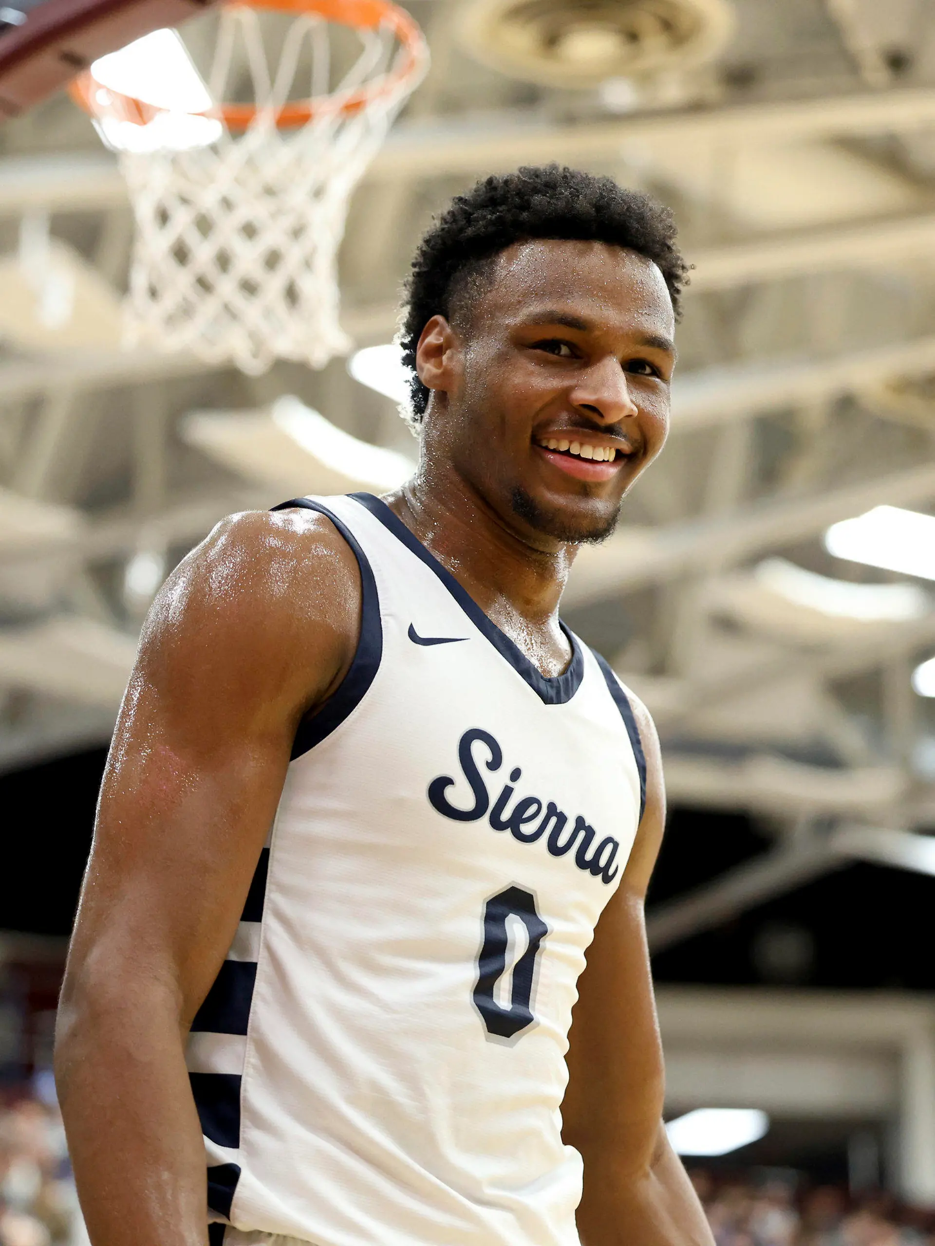 FILE - Sierra Canyon's Bronny James (0) smiles during a high school basketball game against Christopher Columbus at the Hoophall Classic, Monday, Jan. 16, 2023, in Springfield, Mass. Bronny James, son of NBA superstar LeBron James, was hospitalized after going into cardiac arrest while participating in a practice at Southern California on Monday, July 24, 2023. (AP Photo/Gregory Payan, File)