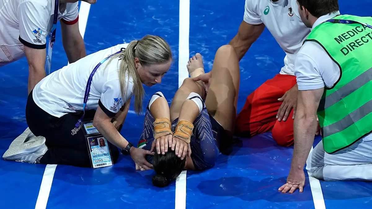 Bulgaria's Valentina Georgieva lays on the mat after an injury during competition in the women's vault final during the European Gymnastics Championships in Munich, Germany, Sunday, Aug. 14, 2022. (AP Photo/Martin Meissner)