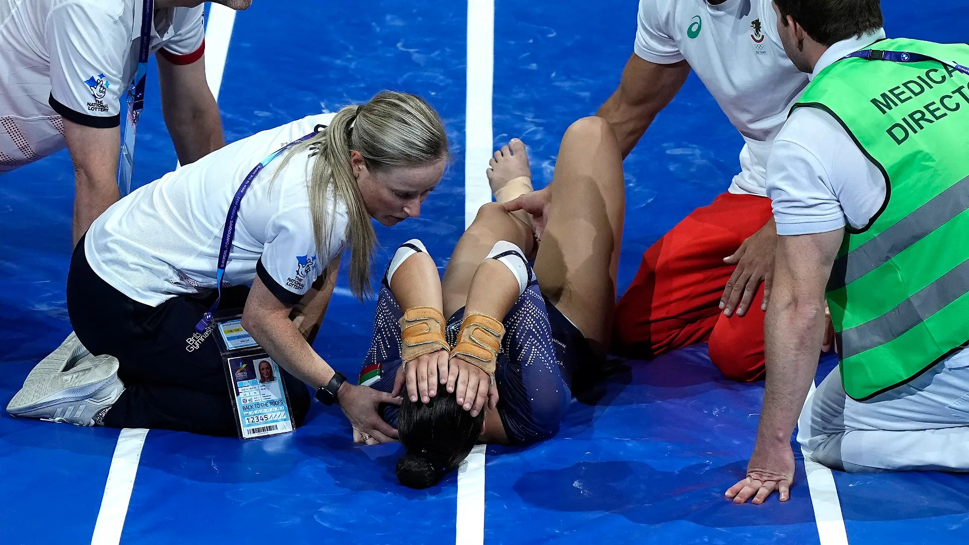 Bulgaria's Valentina Georgieva lays on the mat after an injury during competition in the women's vault final during the European Gymnastics Championships in Munich, Germany, Sunday, Aug. 14, 2022. (AP Photo/Martin Meissner)