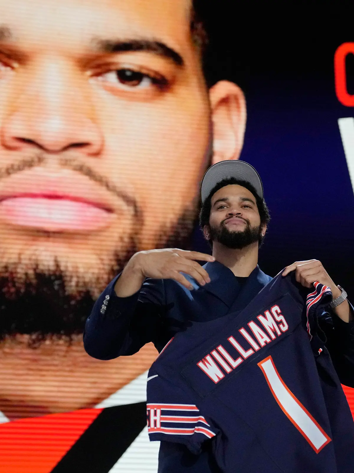 Southern California quarterback Caleb Williams celebrates after being chosen by the Chicago Bears with the first overall pick during the first round of the NFL football draft, Thursday, April 25, 2024, in Detroit. (AP Photo/Jeff Roberson)