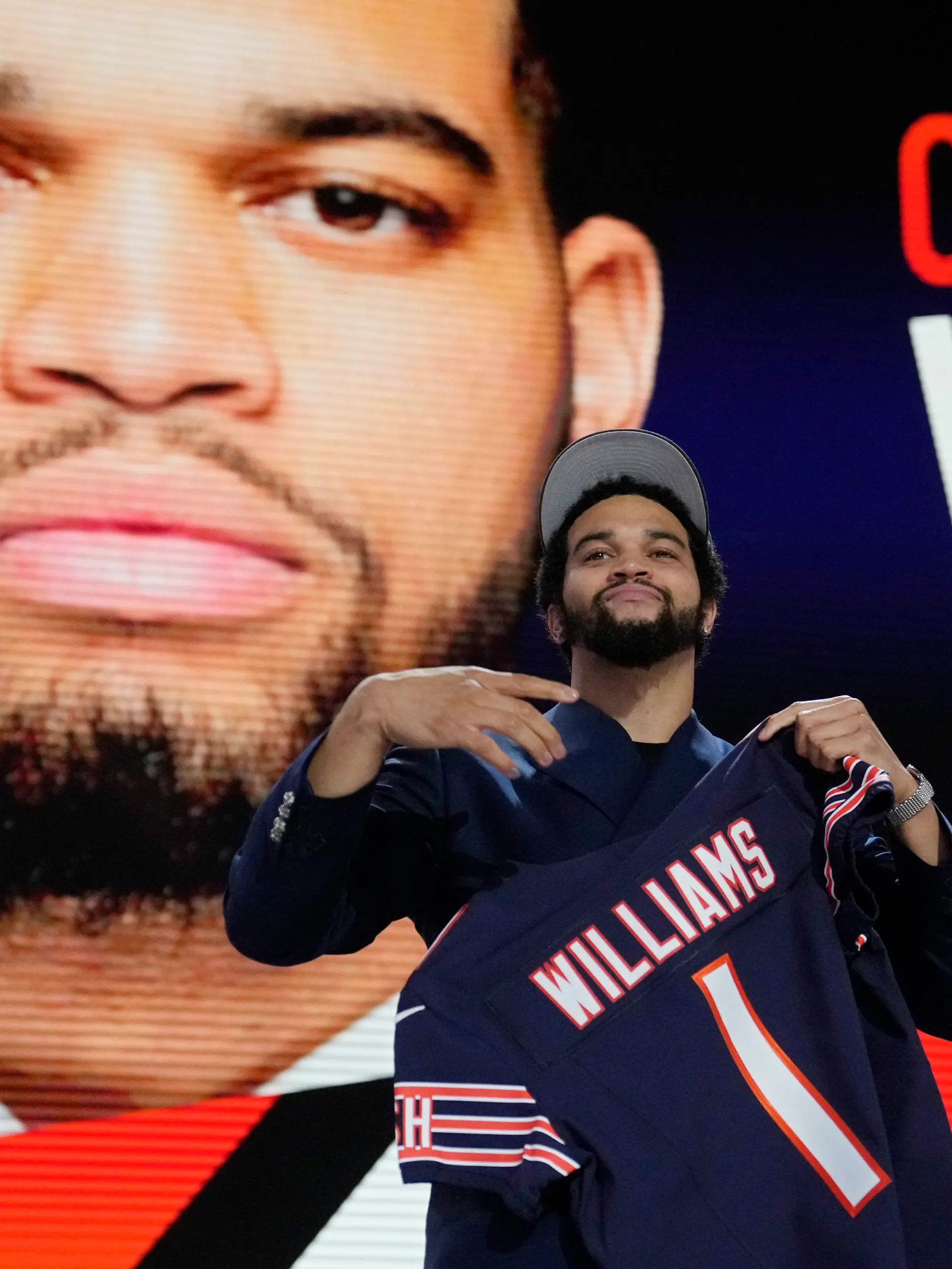 Southern California quarterback Caleb Williams celebrates after being chosen by the Chicago Bears with the first overall pick during the first round of the NFL football draft, Thursday, April 25, 2024, in Detroit. (AP Photo/Jeff Roberson)