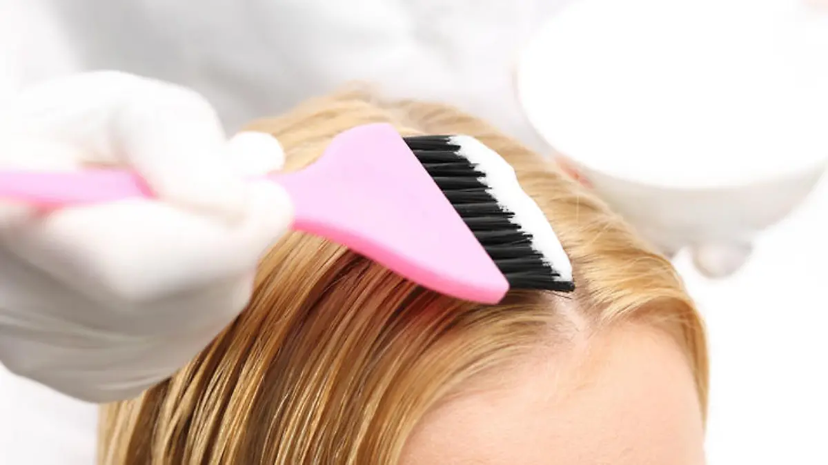 Barber hair dye is applied with a brush 