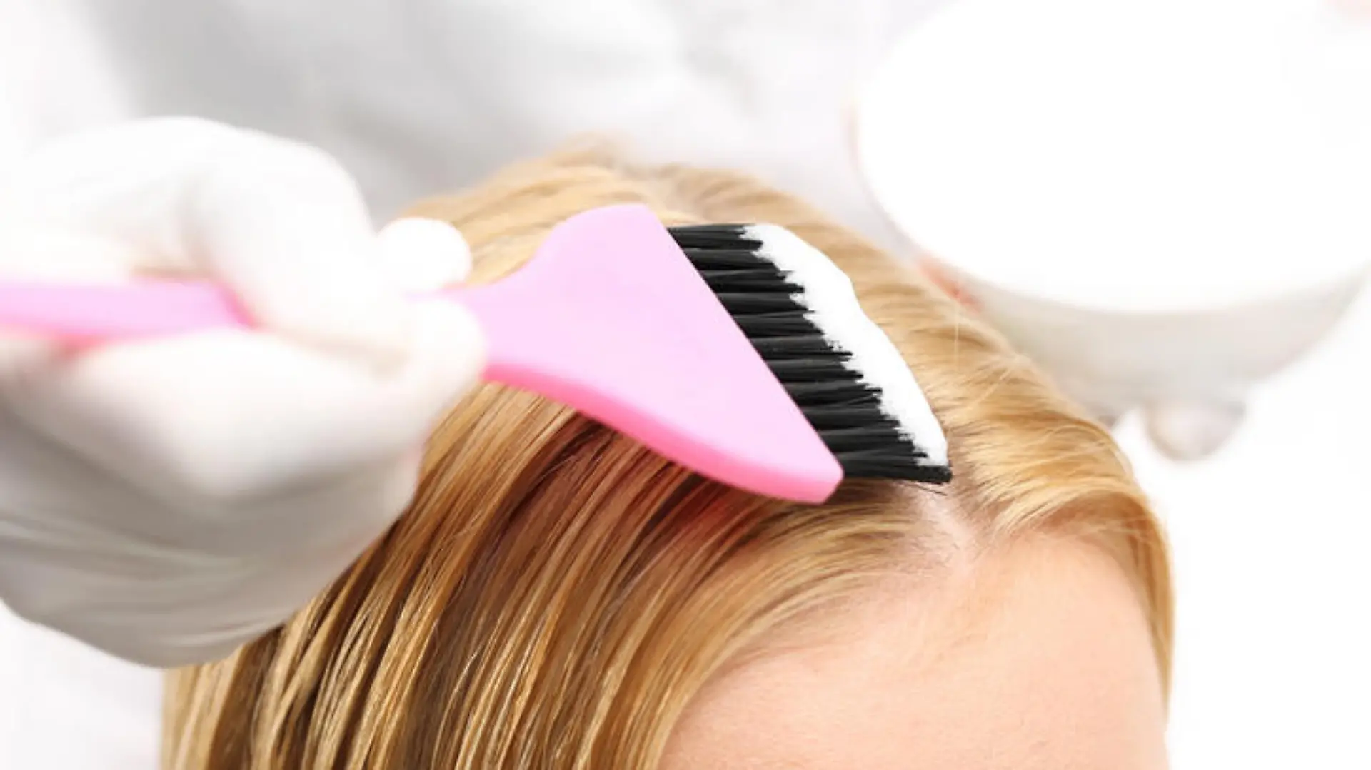 Barber hair dye is applied with a brush 