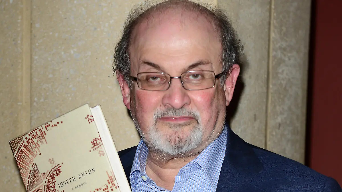 Salman Rushdie 
presents and sign copies of His new Book 'Joseph Anton: A Memoir' presented by Books and Books at Chapman Conference Center at Miami Dade College, Miami, Florida, USA, 26th September 2013.
half length blue suit shirt glasses holding book beard facial hair 
CAP/MPI/MPI10
©MPI10/MPI/Capital Pictures