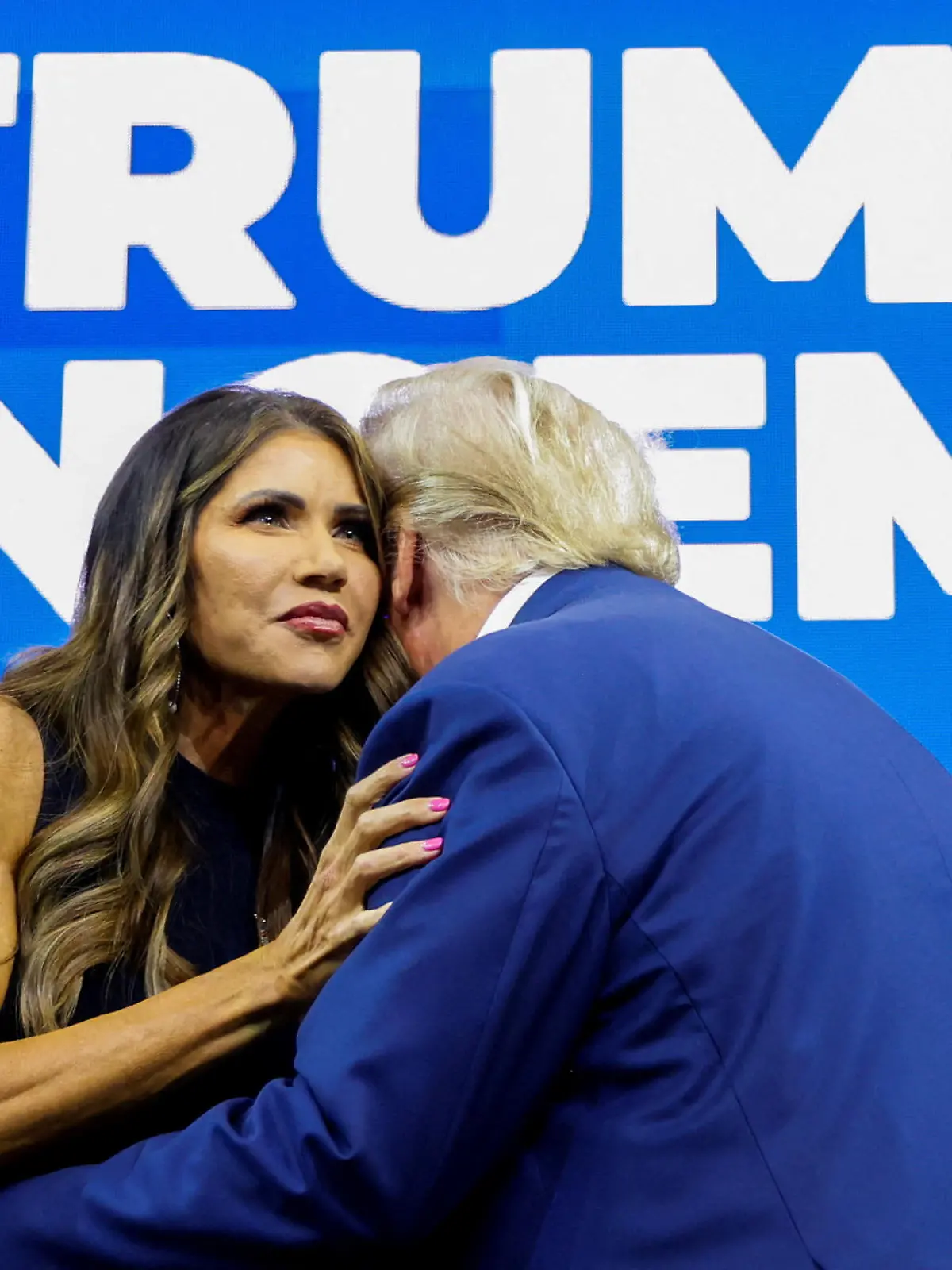 FILE PHOTO: South Dakota Governor Kristi Noem greets former U.S. President and Republican presidential candidate Donald Trump before he speaks at a South Dakota Republican party rally in Rapid City, South Dakota, U.S. September 8, 2023. REUTERS/Jonathan Ernst/File Photo