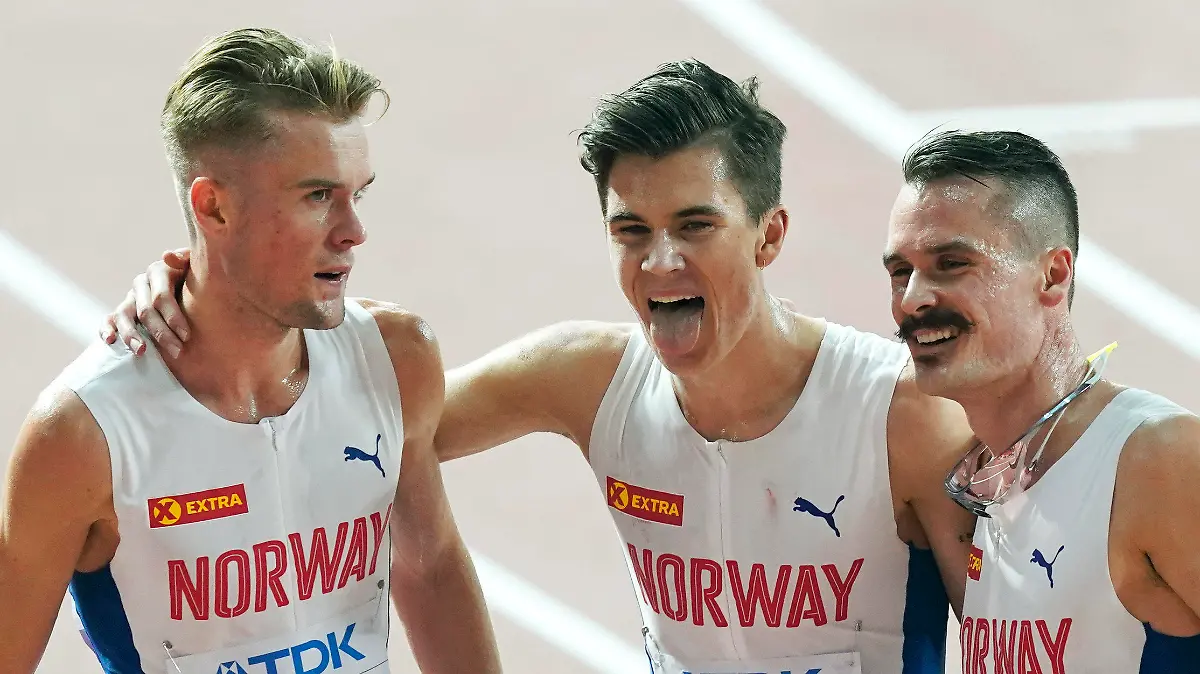 FILE - From left, brothers Filip Ingebrigtsen, Jakob Ingebrigtsen, and Henrik Ingebrigtsen, of Norway, react after competing in the men's 5000 meter final at the World Athletics Championships in Doha, Qatar, on Sept. 30, 2019. Father of Ingebrigtsen brothers is charged with abuse of “one of his minor children,” lawyer says. (AP Photo/Nick Didlick, File)