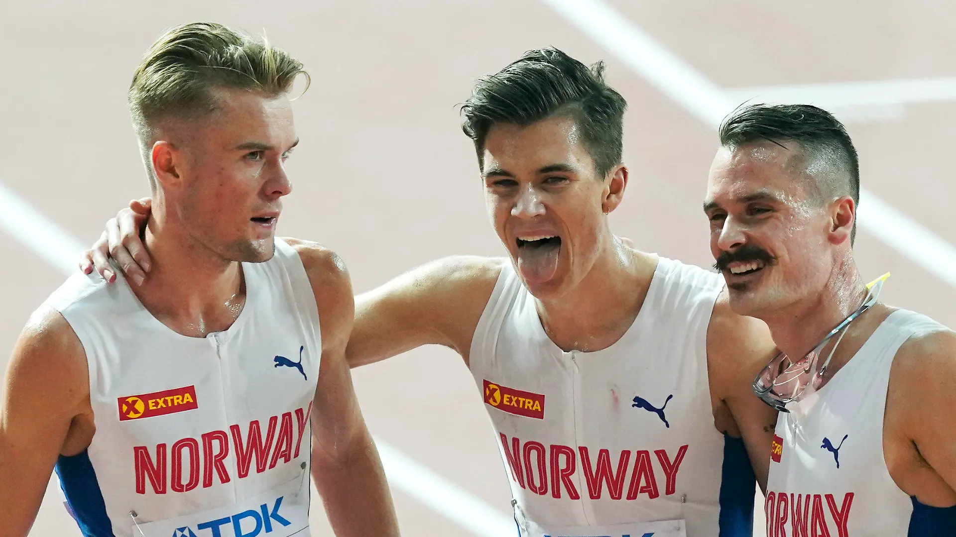 FILE - From left, brothers Filip Ingebrigtsen, Jakob Ingebrigtsen, and Henrik Ingebrigtsen, of Norway, react after competing in the men's 5000 meter final at the World Athletics Championships in Doha, Qatar, on Sept. 30, 2019. Father of Ingebrigtsen brothers is charged with abuse of “one of his minor children,” lawyer says. (AP Photo/Nick Didlick, File)