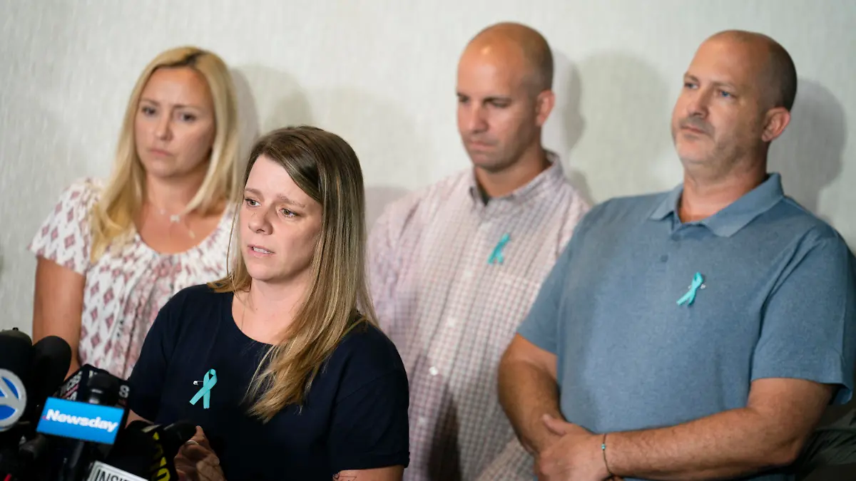 Nicole Schmidt, mother of Gabby Petito, whose death on a cross-country trip has sparked a manhunt for her boyfriend Brian Laundrie, speaks alongside, from left, Tara Petito, stepmother, Jim Schmidt, stepfather, and Joseph Petito, father, during a news conference, Tuesday, Sept. 28, 2021, in Bohemia, N.Y. (AP Photo/John Minchillo)