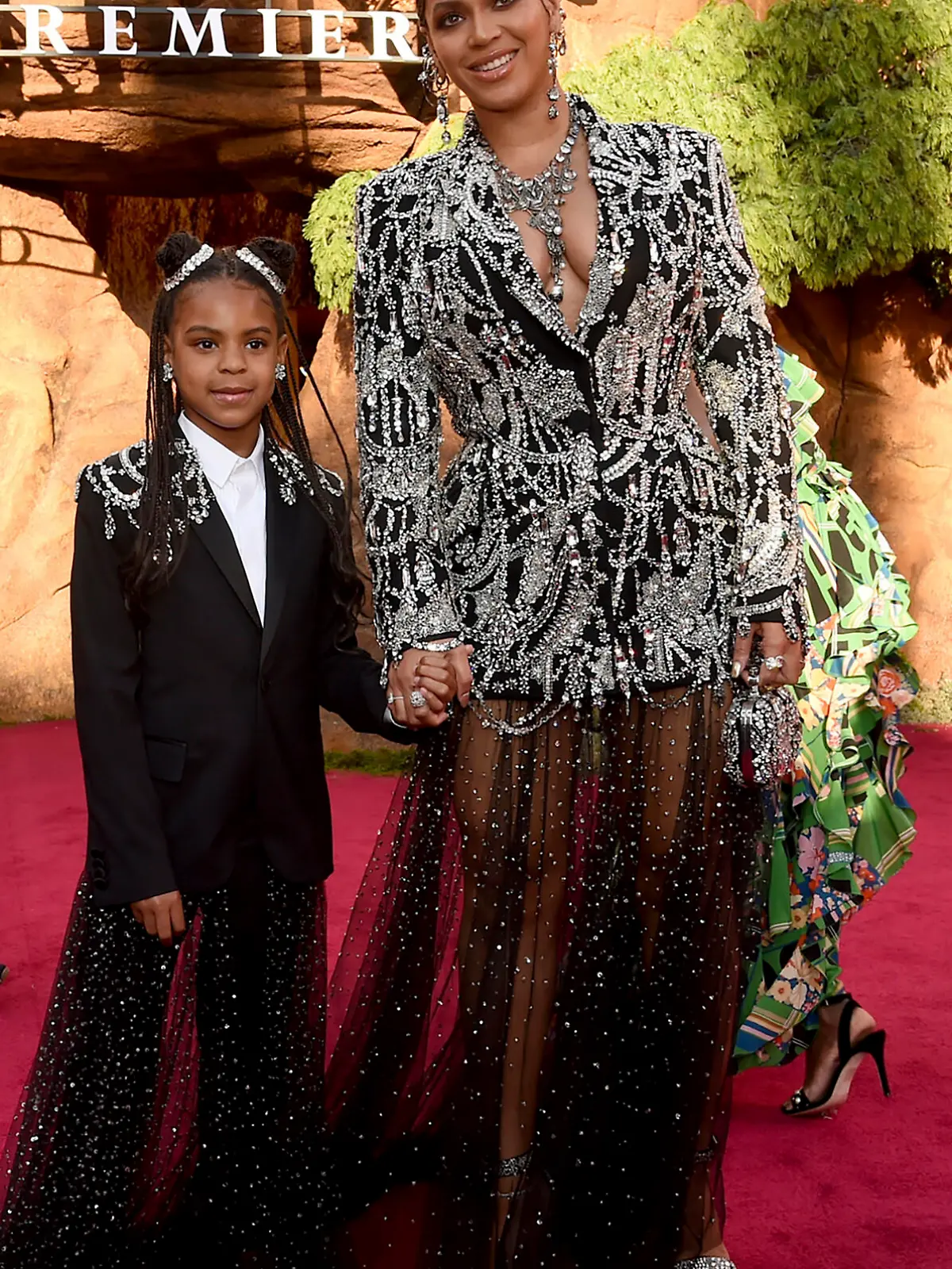 FILE - Beyonce, right, and her daughter Blue Ivy Carter arrive at the world premiere of "The Lion King" in Los Angeles on July 9, 2019. Blue Ivy's name was added to the nominee list for best music video for her mother's ?Brown Skin Girl." (Photo by Chris Pizzello/Invision/AP, File)