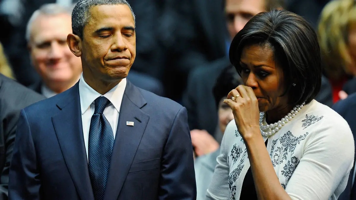  President Barack Obama L comforts his wife first lady Michelle Obama after his speech at the event Together We Thrive: Tucson and America honoring the January 8 shooting victims at McKale Memorial Center on the University of Arizona campus on January 12, 2011 in Tucson, Arizona. The memorial service is in honor of victims of the mass shooting at a Safeway grocery store that killed six and injured at least 13 others, including U.S. Rep. Gabrielle Giffords D-AZ, who remains in critical condition after being shot in the head. Among those killed were U.S. District Judge John Roll, 63 Giffords director of community outreach, Gabe Zimmerman, 30 and 9-year-old Christina Taylor Green. PUBLICATIONxINxGERxSUIxAUTxHUNxONLY TUC20110112160558
