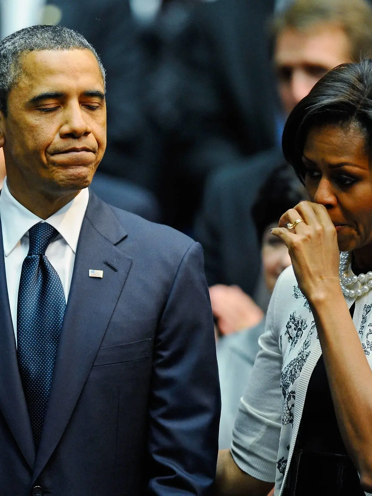  President Barack Obama L comforts his wife first lady Michelle Obama after his speech at the event Together We Thrive: Tucson and America honoring the January 8 shooting victims at McKale Memorial Center on the University of Arizona campus on January 12, 2011 in Tucson, Arizona. The memorial service is in honor of victims of the mass shooting at a Safeway grocery store that killed six and injured at least 13 others, including U.S. Rep. Gabrielle Giffords D-AZ, who remains in critical condition after being shot in the head. Among those killed were U.S. District Judge John Roll, 63 Giffords director of community outreach, Gabe Zimmerman, 30 and 9-year-old Christina Taylor Green. PUBLICATIONxINxGERxSUIxAUTxHUNxONLY TUC20110112160558