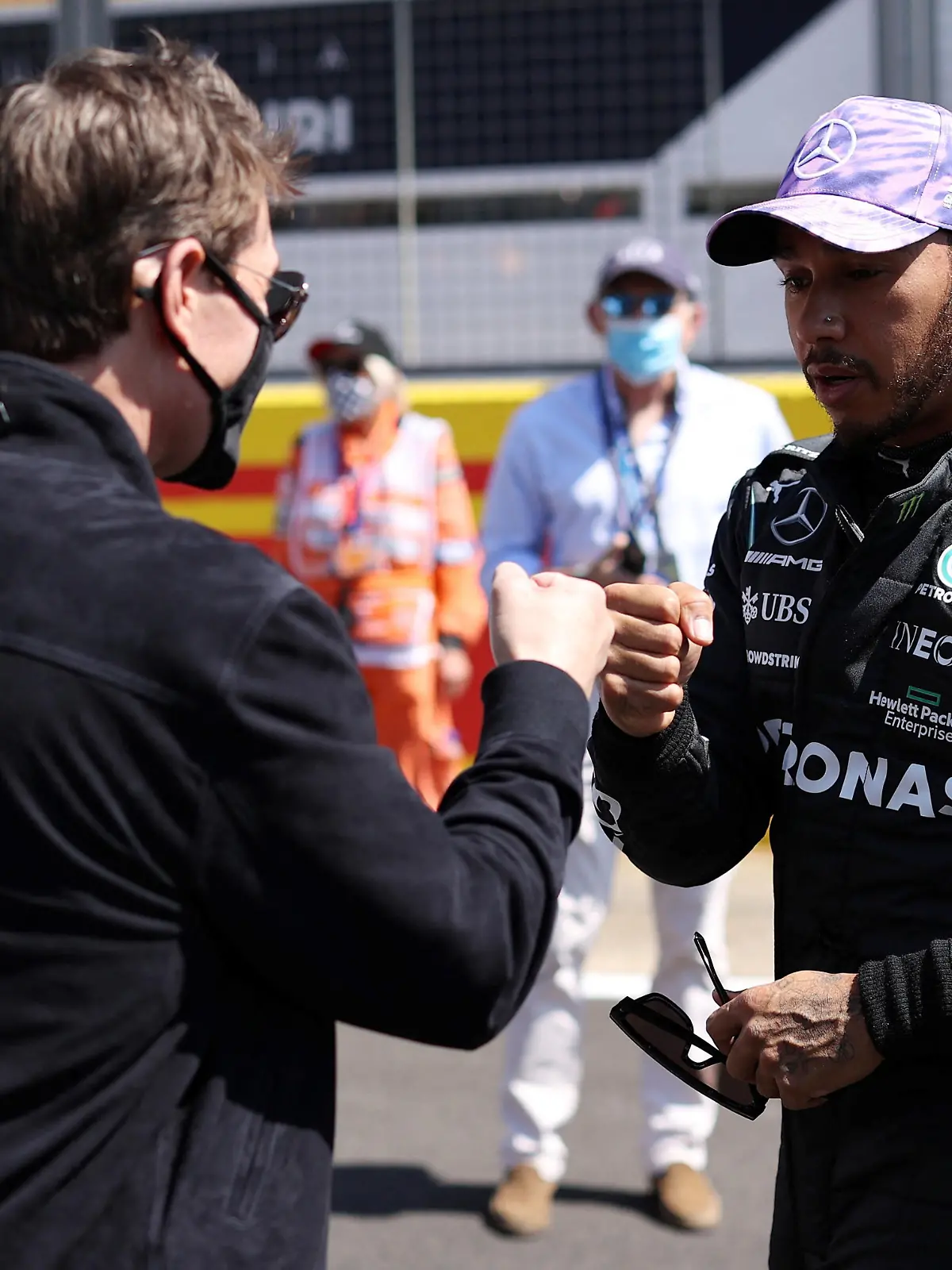 FILE PHOTO: Formula One F1 - British Grand Prix - Silverstone Circuit, Silverstone, Britain - July 18, 2021 Mercedes' Lewis Hamilton with Tom Cruise before the race Pool via REUTERS/Lars Baron/File Photo