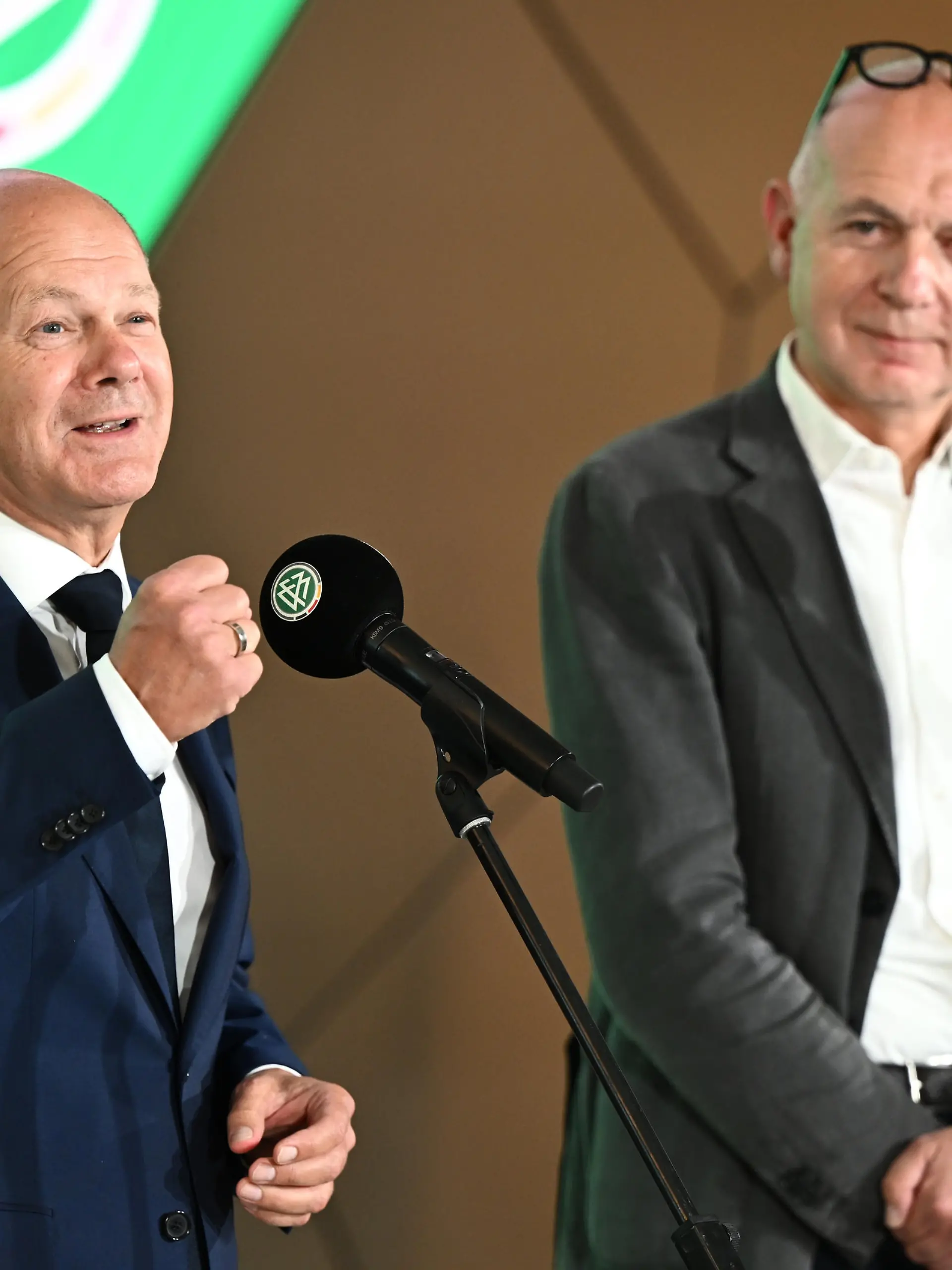 FRANKFURT AM MAIN, GERMANY - AUGUST 09: German Chancellor Olaf Scholz (L) and DFB President Bernd Neuendorf speak to the media during a visit of the chancellor at DFB-Campus on August 09, 2022 in Frankfurt am Main, Germany. (Photo by Alexander Scheuber/Getty Images)