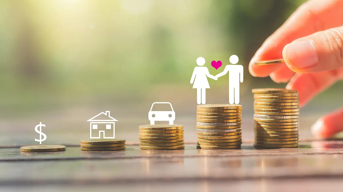 hand put coin stacking on wood table in park against green blur background with money, shopping, travel, car, home and couple people symbol concept target saving planning for long future.