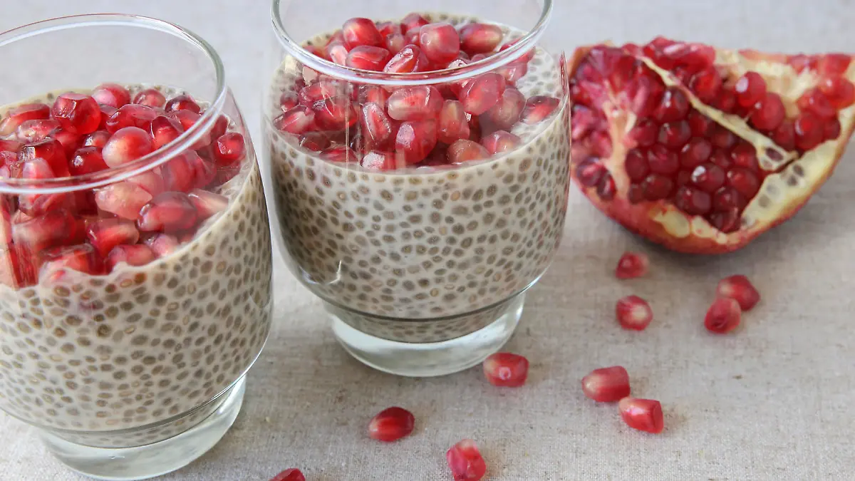 Chia seeds pudding with pomegranate and cherries, selective focus