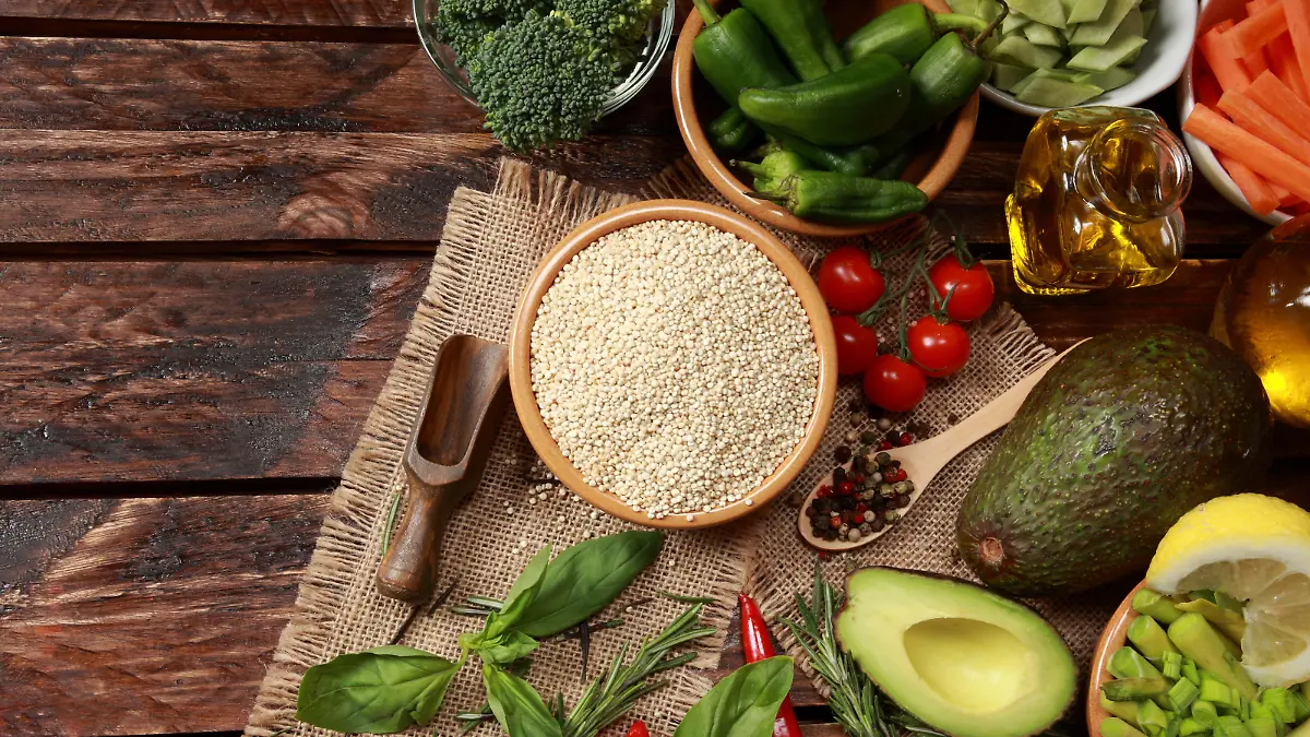 Quinoa Seeds main subject of healthy food contain Protein Vitamin B and Dietary Minerals surrounded with Vegetables