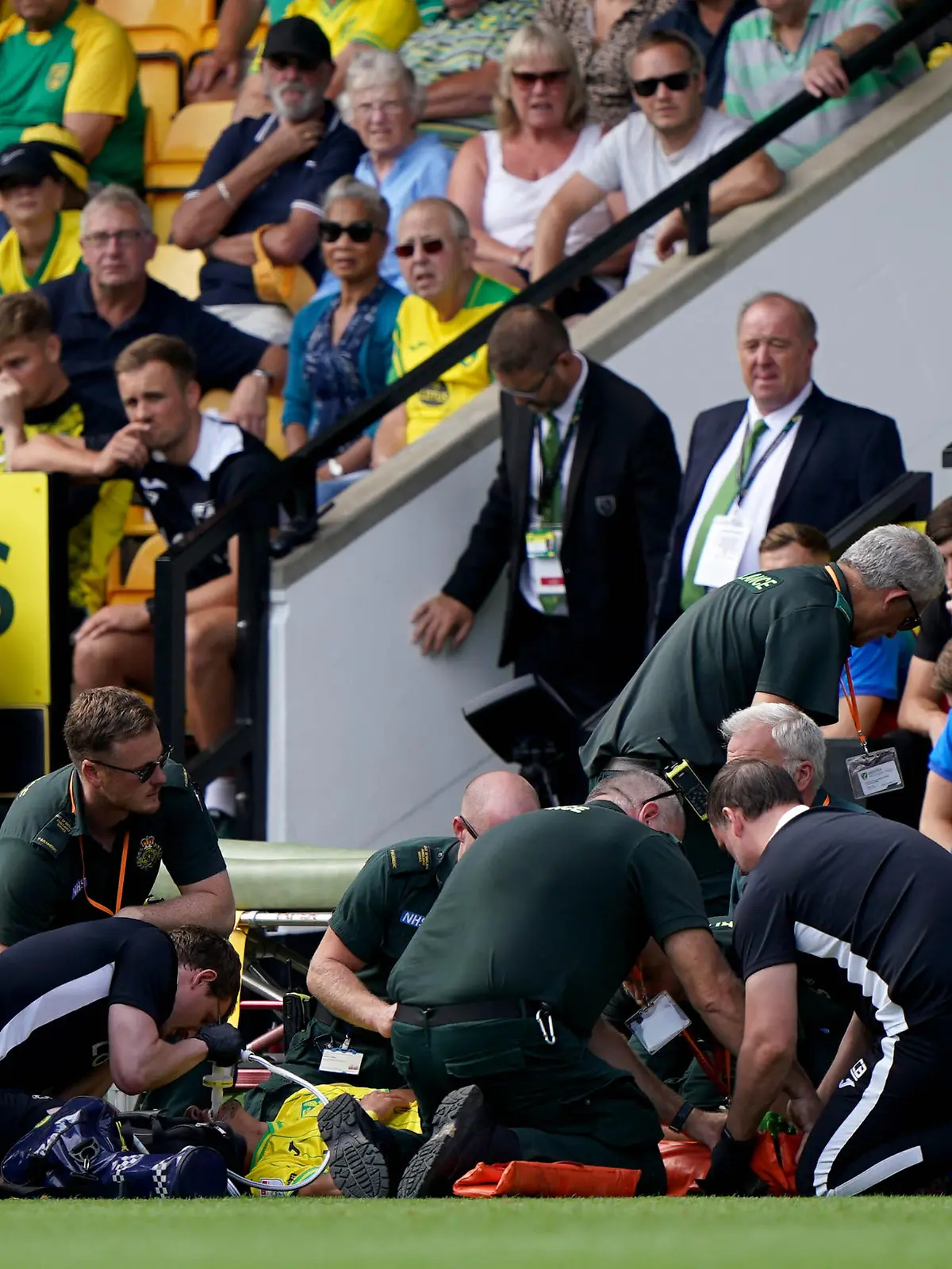 Norwich City v Wigan Athletic - Sky Bet Championship - Carrow Road. Norwich City's Dimitris Giannoulis is treated by medical staff on the pitch after being injured during the Sky Bet Championship match at Carrow Road, Norwich. Picture date: Saturday August 6, 2022. See PA story SOCCER Norwich. Photo credit should read: Joe Giddens/PA Wire. RESTRICTIONS: EDITORIAL USE ONLY No use with unauthorised audio, video, data, fixture lists, club/league logos or "live" services. Online in-match use limited to 120 images, no video emulation. No use in betting, games or single club/league/player publications. URN:68195065