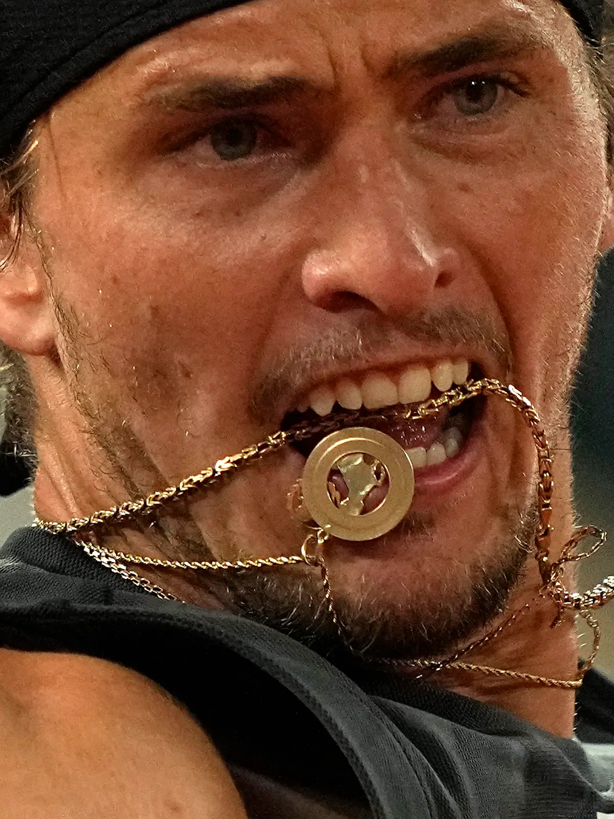 Germany's Alexander Zverev 's chain goes in his month as he plays Spain's Rafael Nadal during their semifinal match of the French Open tennis tournament at the Roland Garros stadium Friday, June 3, 2022 in Paris. (AP Photo/Michel Euler)