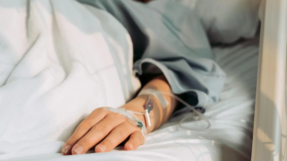 Asian woman lying sick in hospital.