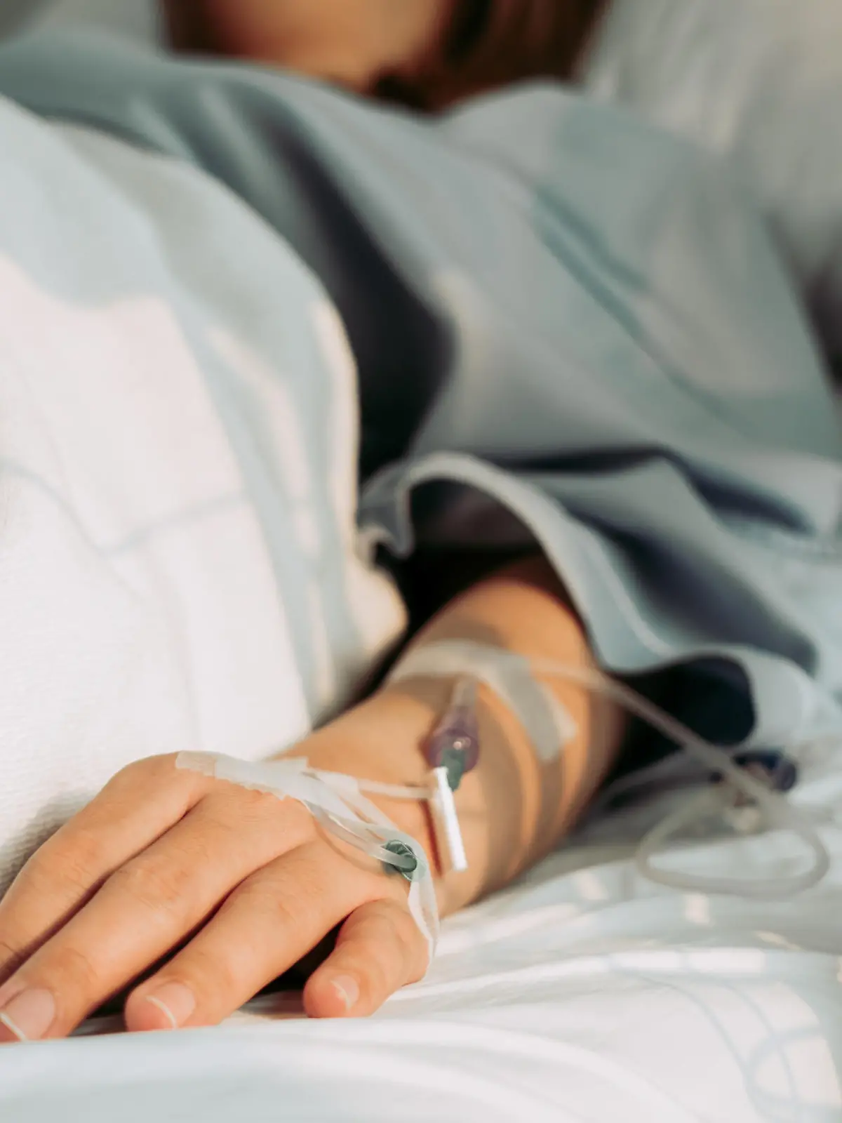 Asian woman lying sick in hospital.