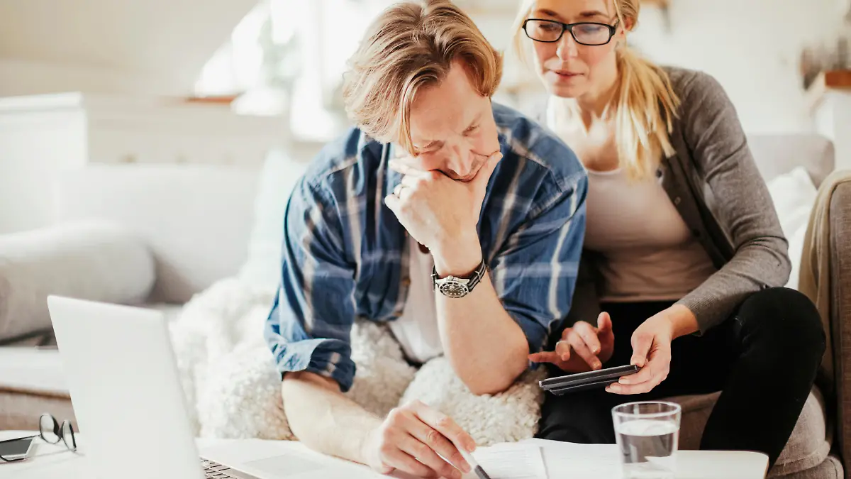 Photo of a mature couple calculating home finances