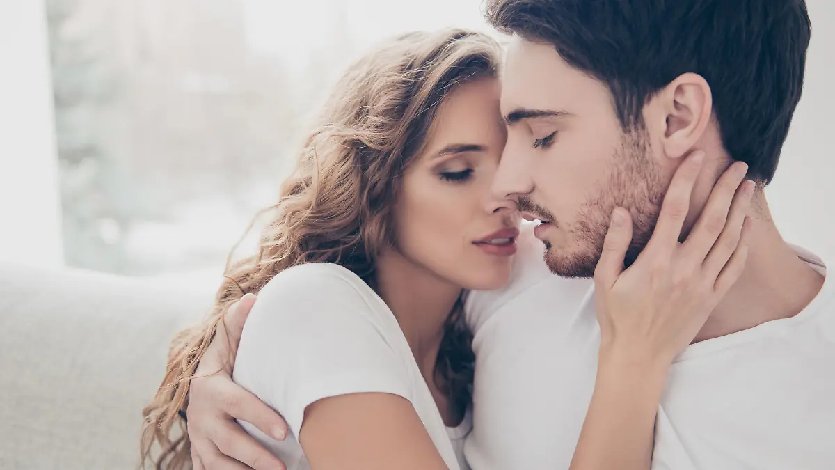 Recreation delight weekend holiday happiness satisfaction concept. Head shot portrait of romantic sexy couple keeping eyes closed enjoying time together kissing bonding indoor