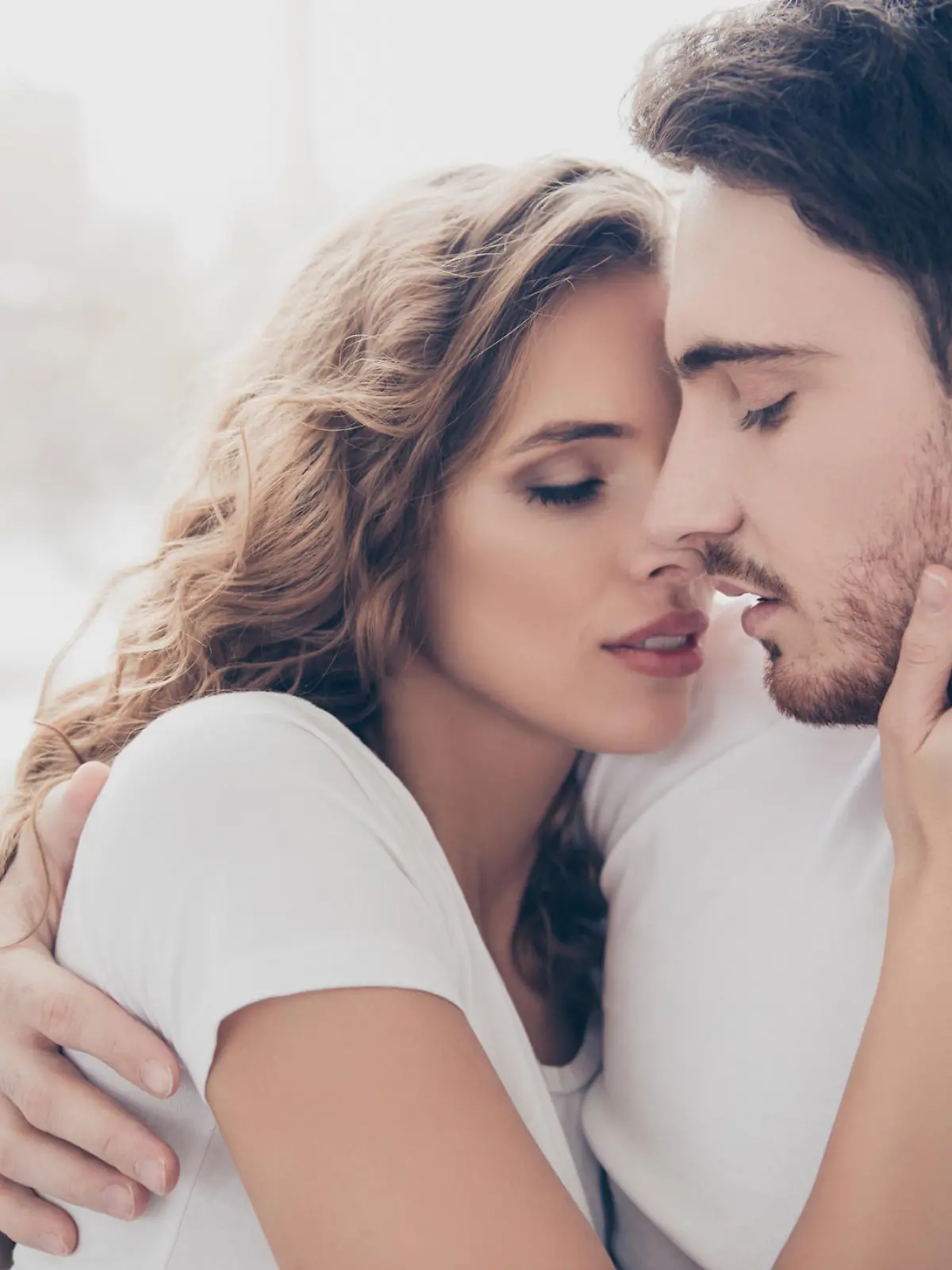Recreation delight weekend holiday happiness satisfaction concept. Head shot portrait of romantic sexy couple keeping eyes closed enjoying time together kissing bonding indoor