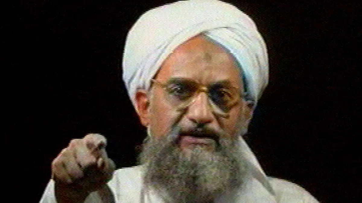 FILE - In this file image from television transmitted by the Arab news channel Al-Jazeera on Monday Jan. 30, 2006, Al-Qaida's then deputy leader Ayman al-Zawahri gestures while addressing the camera. Al-Qaida's central leadership broke with one of its most powerful branch commanders, who in defiance of its orders spread his operations from Iraq to join the fighting in Syria and fueled bitter infighting among Islamic militant factions in Syria¿s civil war. The break, announced in a statement Monday, appeared to be an attempt by Al-Zawahri, to establish control over the feuding militant groups in Syria and stem the increasingly bloody reprisals among them. (AP Photo/Al-Jazeera, File)