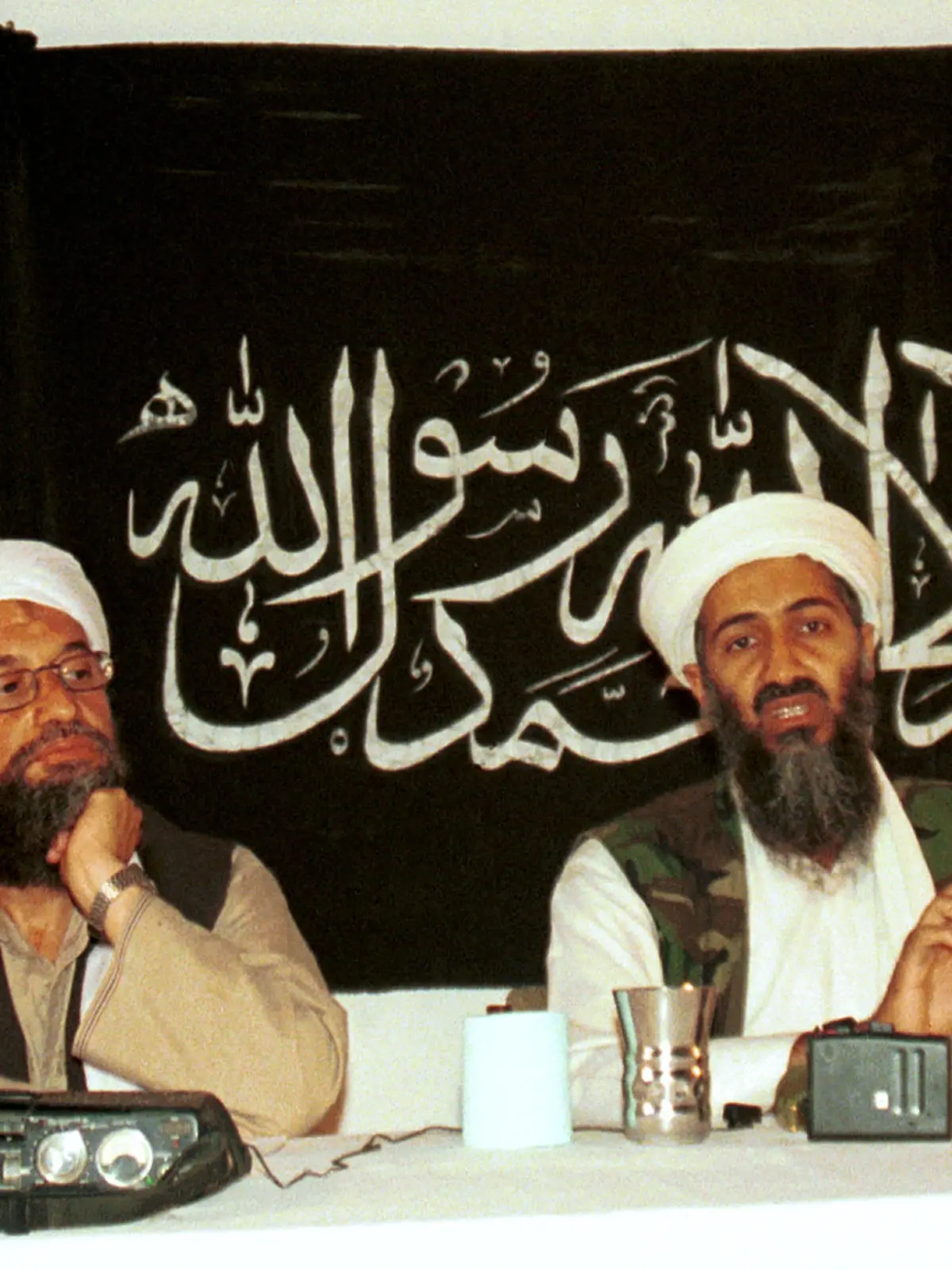 FILE - In this 1998 file photo made available Friday, March 19, 2004, Ayman al-Zawahri, left, holds a press conference with Osama bin Laden in Khost, Afghanistan. Al-Qaida's central leadership broke with one of its most powerful branch commanders, who in defiance of its orders spread his operations from Iraq to join the fighting in Syria and fueled bitter infighting among Islamic militant factions in Syria¿s civil war. The break, announced in a statement Monday, appeared to be an attempt by Al-Zawahri, to establish control over the feuding militant groups in Syria and stem the increasingly bloody reprisals among them. (AP Photo/Mazhar Ali Khan, File)