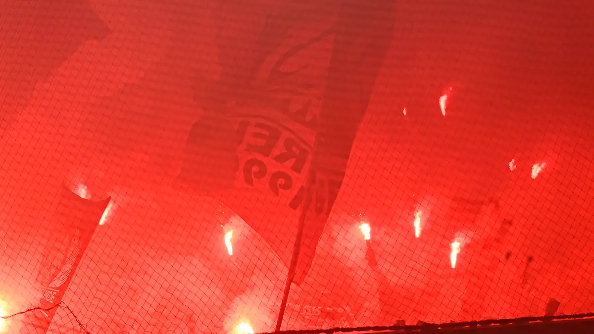 Soccer Football - DFB Cup - First Round - FC Magdeburg v Eintracht Frankfurt - MDCC-Arena, Magdeburg, Germany - August 1, 2022 Eintracht Frankfurt fans with flares REUTERS/Fabian Bimmer DFB REGULATIONS PROHIBIT ANY USE OF PHOTOGRAPHS AS IMAGE SEQUENCES AND/OR QUASI-VIDEO.