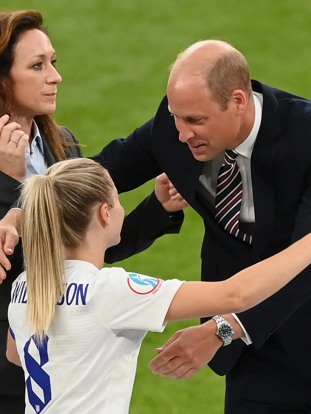 LONDON, ENGLAND - JULY 31: Prince William, Duke of Cambridge,  embraces Leah Williamson of England after their 2-1 win during the UEFA Women's Euro 2022 final match between England and Germany at Wembley Stadium on July 31, 2022 in London, England. (Photo by Michael Regan/Getty Images)
