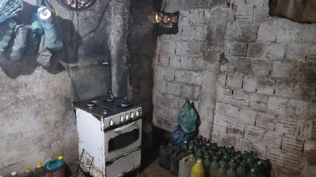 This handout picture released by Rio de Janeiro's Military Police Communication Office shows a room of the house where a woman and two adolescents were imprisoned for 17 years in the neighbouhood of Guaratiba, Rio de Janeiro, Brazil, on 28 July, 2022. - A woman and her two children were rescued by the police from her home in Rio de Janeiro, where they had been locked up for the last 17 years by order of her husband and alleged father. (Photo by Rio de Janeiro Military Police / AFP) / RESTRICTED TO EDITORIAL USE - MANDATORY CREDIT "AFP PHOTO / RIO DE JANEIRO MILITARY POLICE" - NO MARKETING - NO ADVERTISING CAMPAIGNS - DISTRIBUTED AS A SERVICE TO CLIENTS