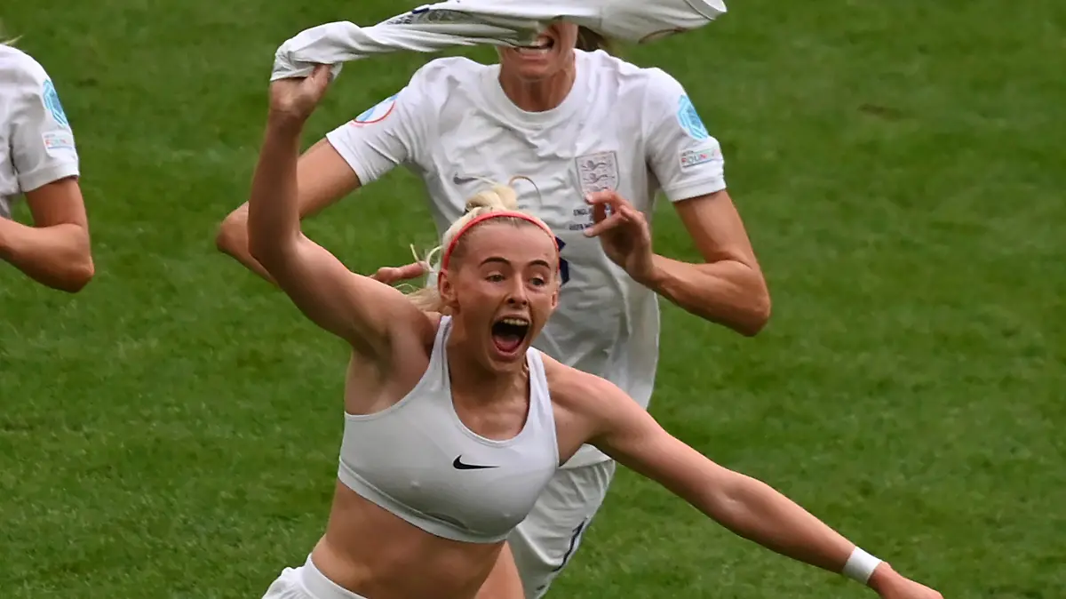 England's Chloe Kelly, centre, celebrates after scoring her side's second goal during the Women's Euro 2022 final soccer match between England and Germany at Wembley stadium in London, Sunday, July 31, 2022. (AP Photo/Rui Vieira)