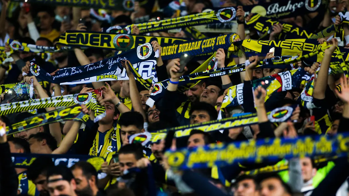 FILE - Fenerbahce fans cheer prior the Europa League group D soccer match between Fenerbahce and Antwerp at the Sukru Saracoglu stadium in Istanbul, Turkey, on Oct. 21, 2021. UEFA is investigating Turkish club Fenerbahçe after its fans chanted the name of Russian President Vladimir Putin during a Champions League qualifying game against Ukraine’s Dynamo Kyiv. The chants were heard at Fenerbahçe’s stadium in Istanbul shortly after Vitaliy Buyalskiy scored the opening goal for Dynamo in a game the Ukrainian team went on to win 2-1 after extra time on Wednesday. (AP Photo, File)
