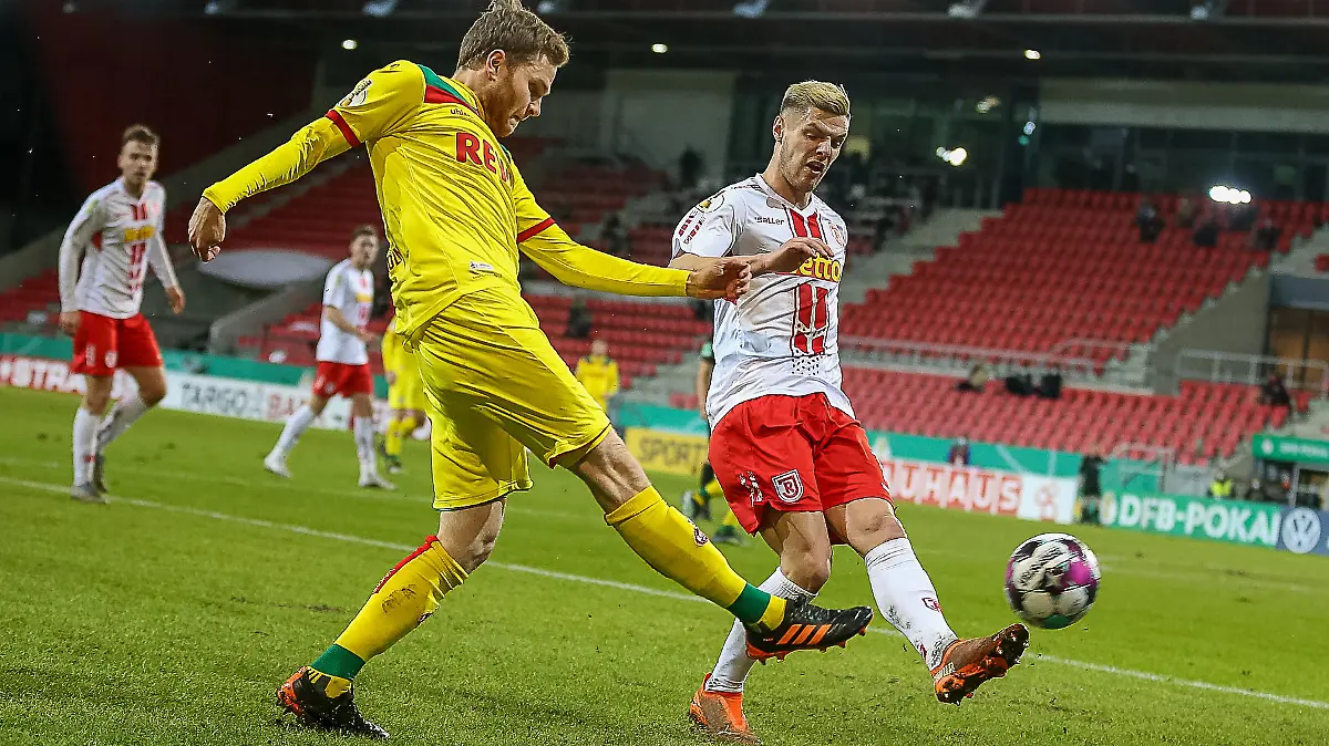 Benno Schmitz (Koeln) Erik Wekesser (Regensburg) SSV Jahn Regensburg vs. 1. FC Koeln, Fussball, DFB Pokal, 03.02.2021 DFL regulations prohibit any use of photographs as image sequences and/or quasi-video. Foto: Eibner/Andreas Nickl