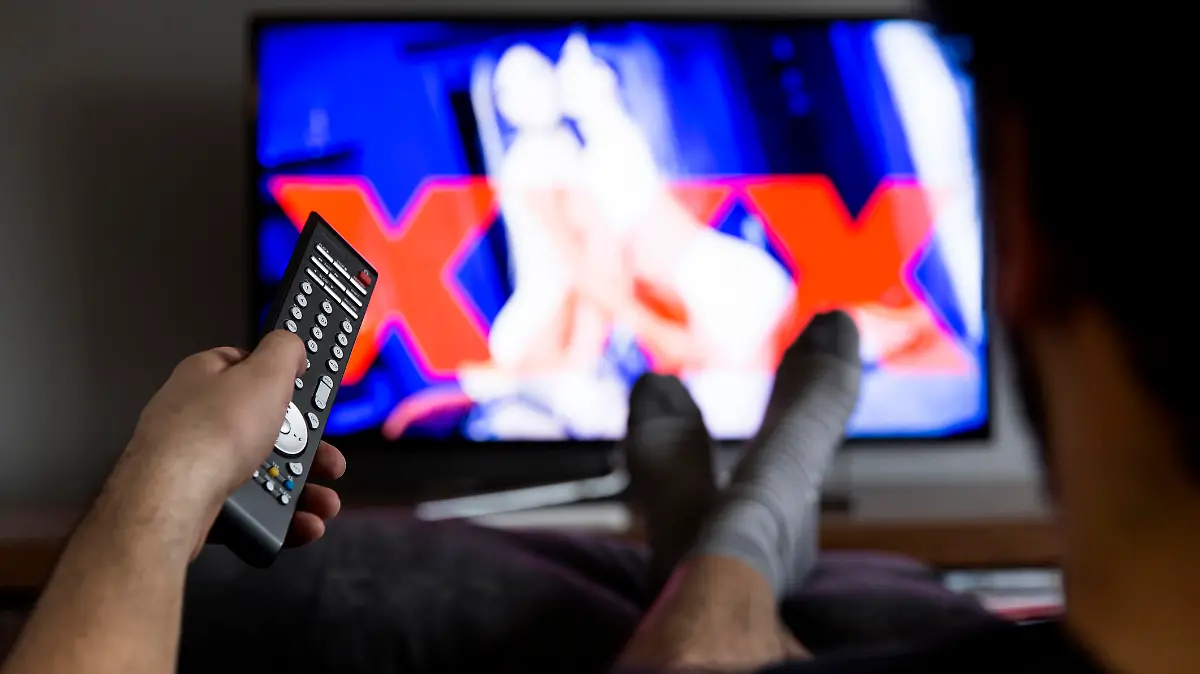 man watching porn on tv
