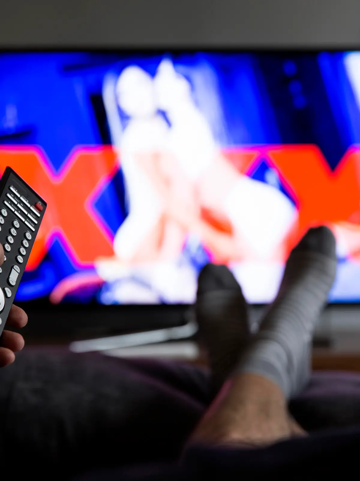 man watching porn on tv