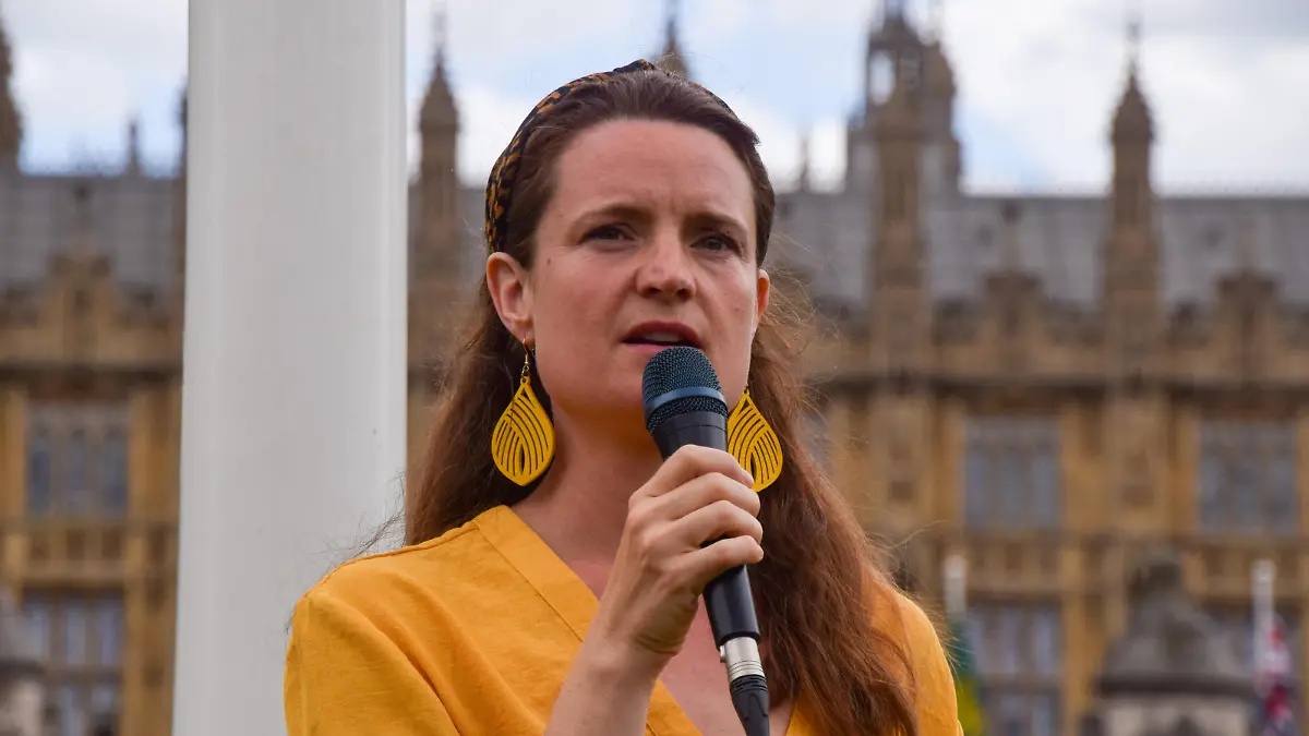 June 24, 2023, London, United Kingdom: Marcus Decker's partner Holly Cullen-Davis speaks in Parliament Square during the demonstration. Just Stop Oil activists and other protesters marched in Westminster in solidarity with jailed activists Marcus Decker and Morgan Trowland, who scaled Queen Elizabeth II Bridge, and called on the government not to deport Marcus from the UK. (Credit Image: © Vuk Valcic/SOPA Images via ZUMA Press Wire