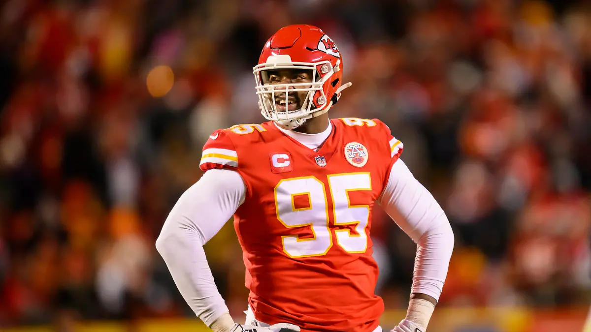 FILE - Kansas City Chiefs defensive tackle Chris Jones smiles during during the second half of the team's NFL AFC championship playoff football game against the Cincinnati Bengals, Jan. 29, 2023 in Kansas City, Mo. Jones, who is entering the final year of his contract with the Chiefs, was absent from the start of Super Bowl champions' mandatory three-day minicamp Tuesday, June 13. (AP Photo/Reed Hoffmann, File)