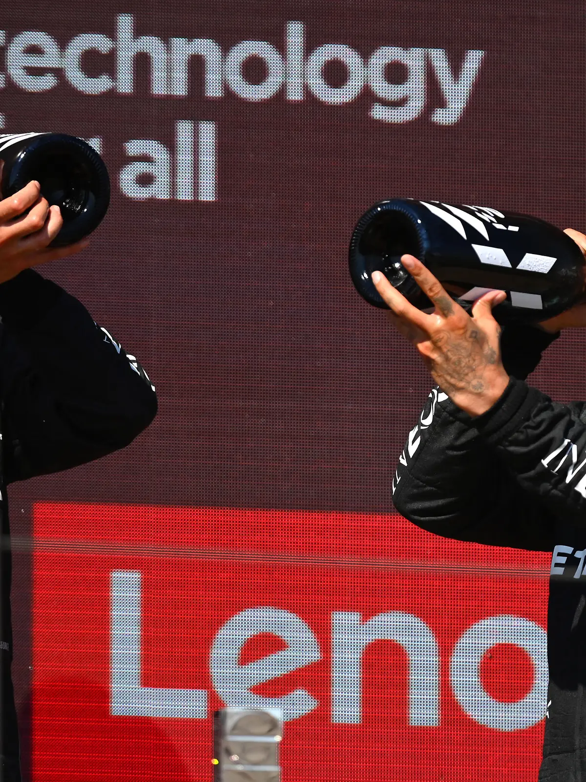 LE CASTELLET, FRANCE - JULY 24: Second placed Lewis Hamilton of Great Britain and Mercedes and Third placed George Russell of Great Britain and Mercedes celebrate on the podium during the F1 Grand Prix of France at Circuit Paul Ricard on July 24, 2022 in Le Castellet, France. (Photo by Dan Mullan/Getty Images)