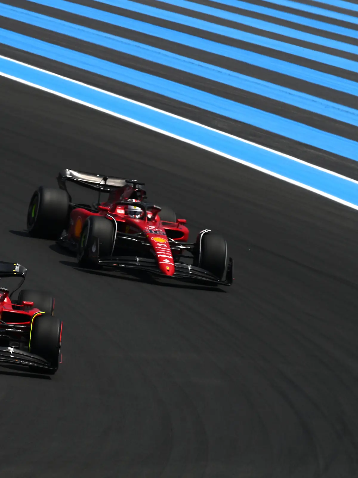 LE CASTELLET, FRANCE - JULY 23: Carlos Sainz of Spain driving (55) the Ferrari F1-75 leads Charles Leclerc of Monaco driving the (16) Ferrari F1-75 during final practice ahead of the F1 Grand Prix of France at Circuit Paul Ricard on July 23, 2022 in Le Castellet, France. (Photo by Dan Mullan/Getty Images)