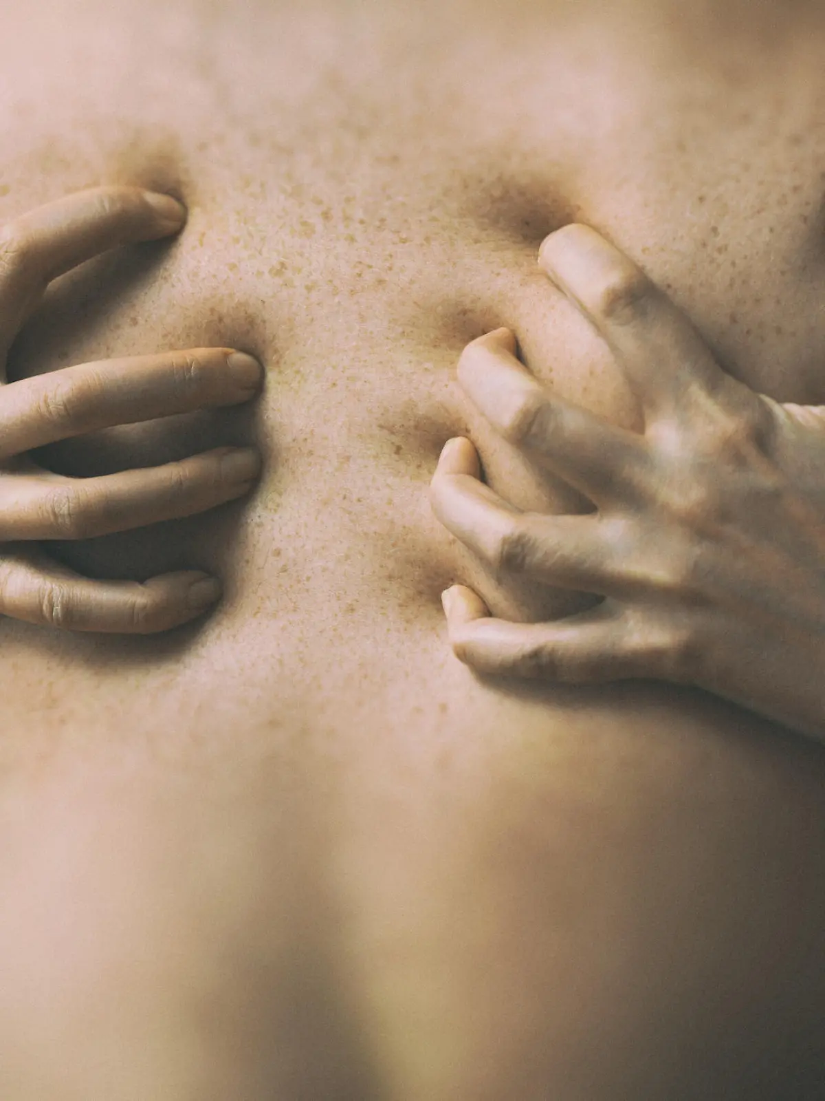 Couple in passion. Female hands on male back.
