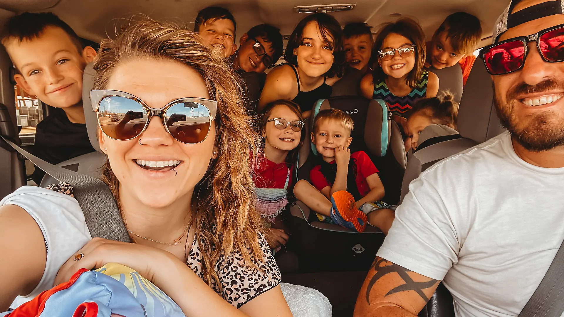 MERCURY PRESS (Pictured: Tracee Schaeffer and the whole family in the car together. ) - A mum of ten children has revealed her crazy schedule, which includes waking up at 4am daily! Tracee Schaeffer, 34, and husband Justin, 40, live together in their Arizona, US, home, along with Dahlila, 14, Beau, 13, Ryan, 12, Scarlett, 11, Tootie, nine, Wyatt, nine, Rhett, eight, Rhiggs, eight, Remy, six, and Ausy, three. Tracee revealed that she keeps on top of things with chore charts for all the children, so she's not left with all the housework alongside running her business, Pop Culture Agency, which helps women in business with their online presence. However, Tracee still must juggle working with home-schooling some of the children, hockey practices, and feeding her chicken. - SEE MERCURY COPY